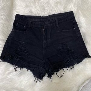Black distressed high waisted jean shorts. Size M/ US4